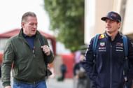 Jos Verstappen and Max Verstappen of the Netherlands and Oracle Red Bull Racing walk in the Paddock during day one of F1 Testing at Bahrain International Circuit - Source: Getty